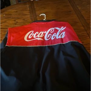 Warm winter coke cola jacket. Sleeves zip off